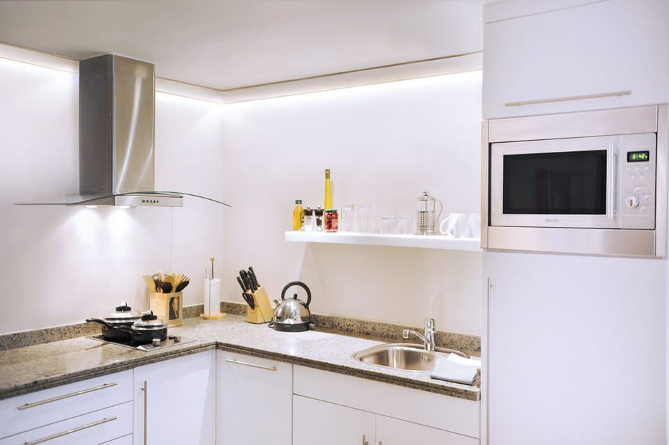 Fridge, microwave, coffee/tea maker, cookware/dishes/utensils