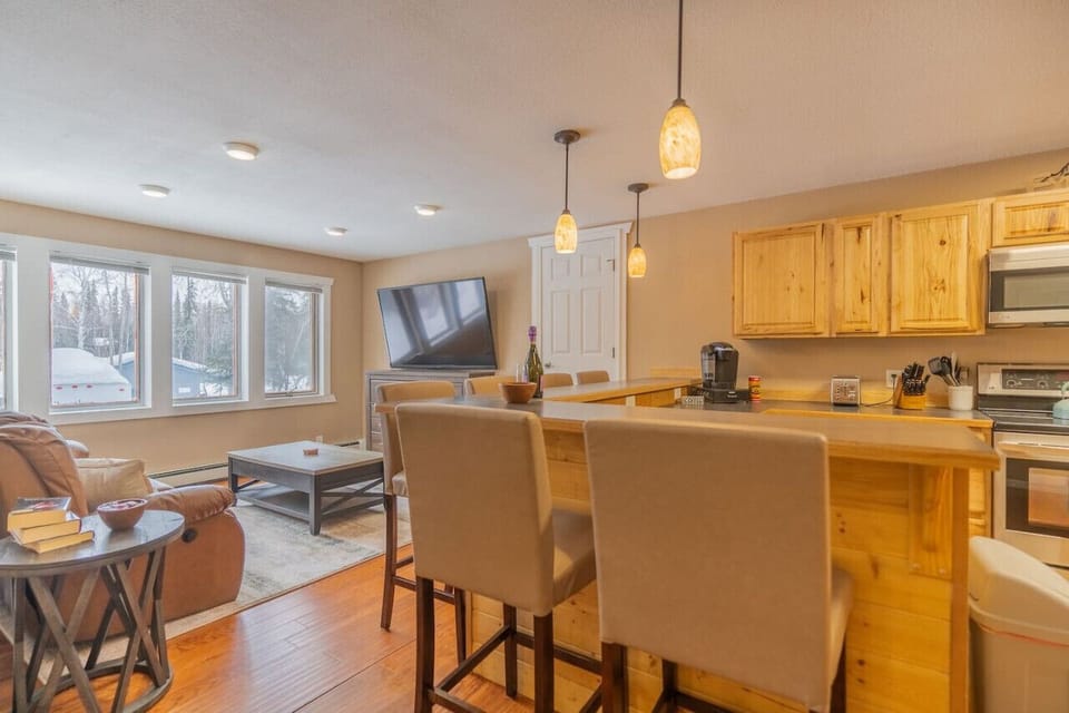 Breakfast Bar Looking Into Kitchen and Living Area