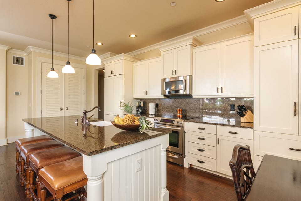 Stainless steel appliances, granite countertops and Subzero refrigerator