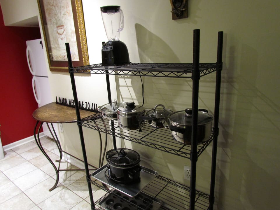 With crock pot and other cooking pots and pans