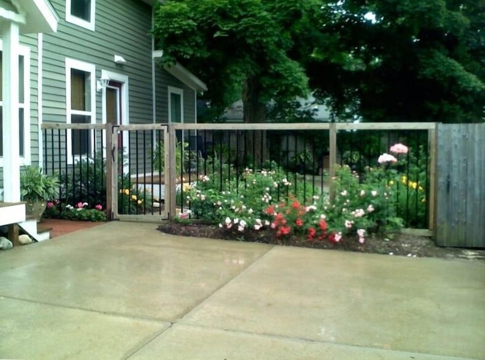 View From Driveway to Gated Side Garden