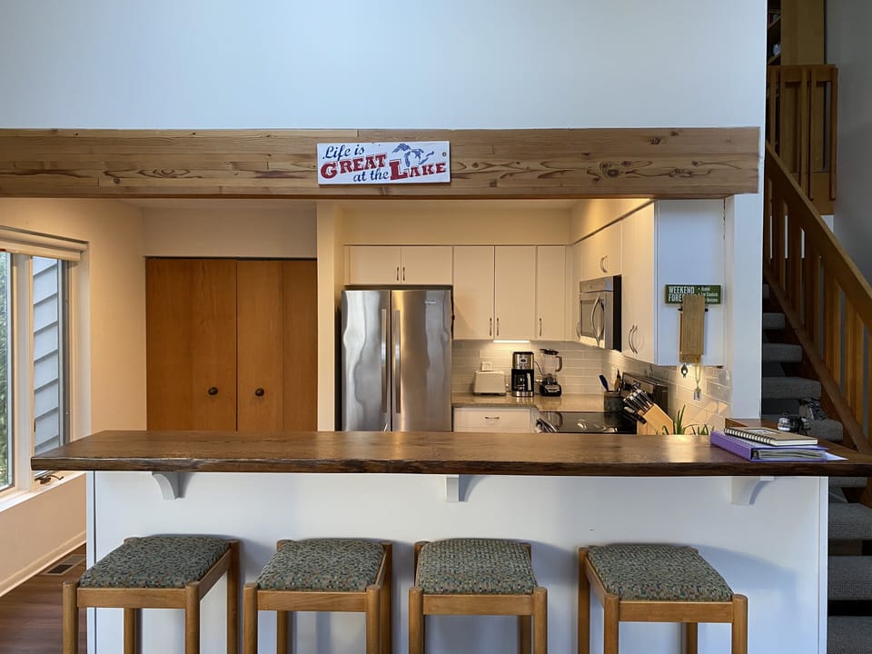 Full kitchen with extra seating for 4