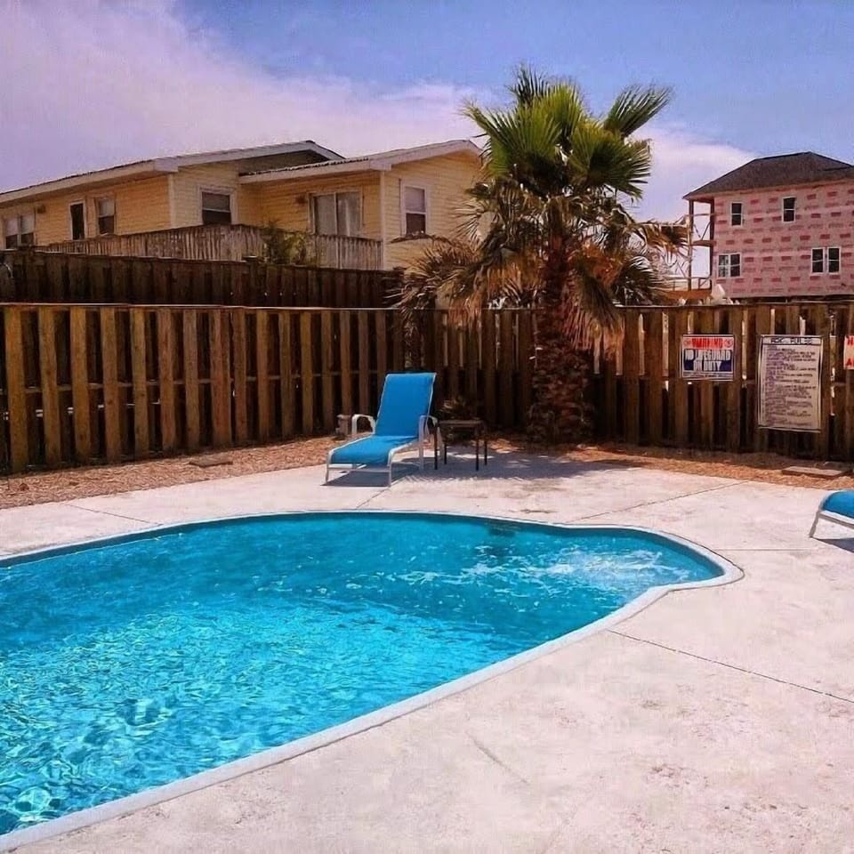 Private pool with fenced backyard
