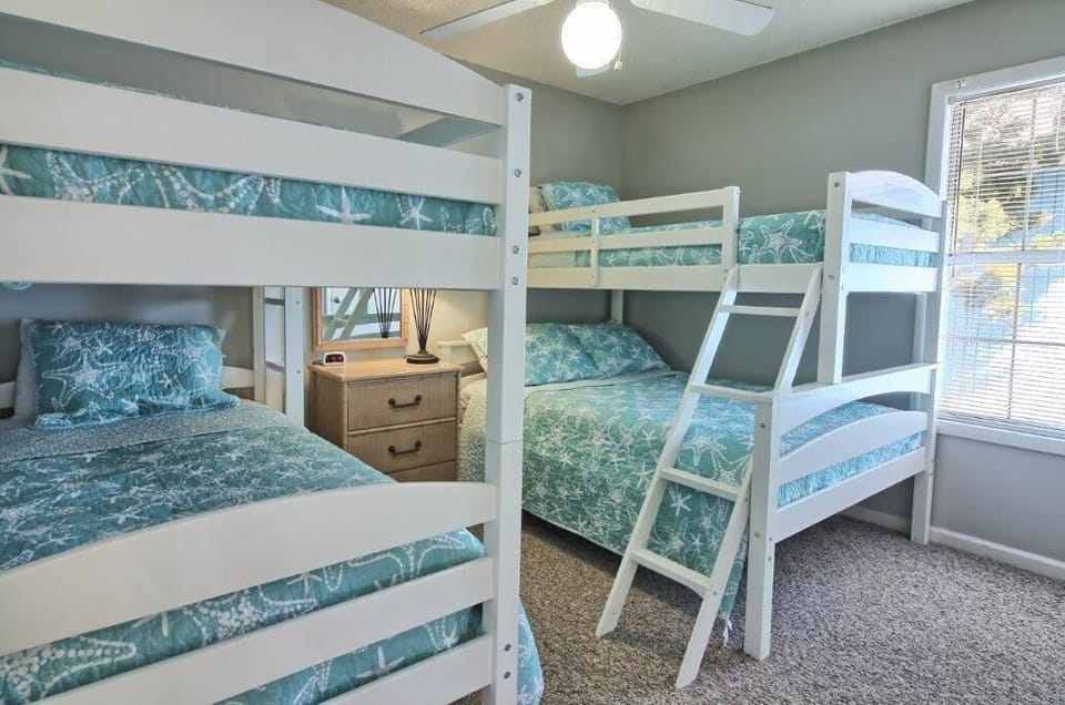 Second bedroom with twin over full bunk bed and twin over twin bunk bed