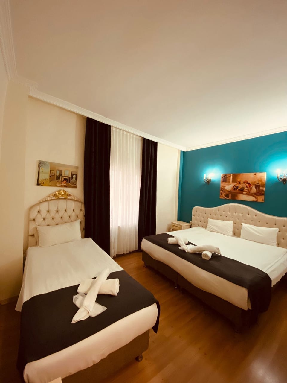 Standard Triple Room | Minibar, in-room safe, desk, soundproofing