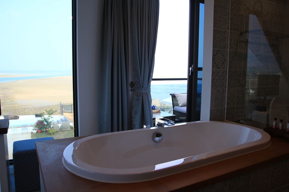 Quadruple Room, Sea View | Bathroom | Separate tub and shower, deep soaking tub, free toiletries, hair dryer