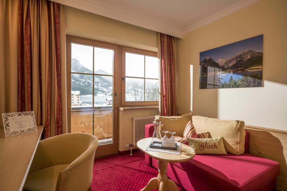 Comfort Double Room, Non Smoking, Balcony | Living room | 45-inch flat-screen TV with satellite channels, toys
