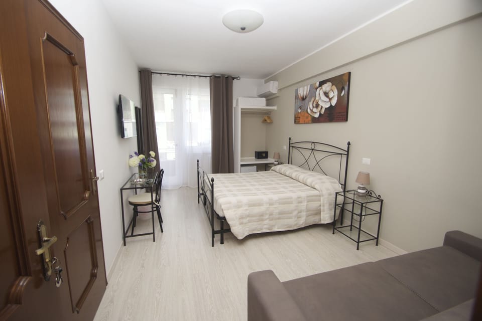 Comfort Quadruple Room | Premium bedding, in-room safe, desk, soundproofing