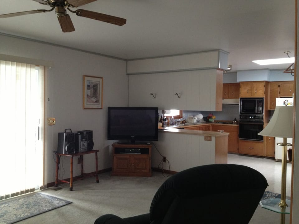 Family room opens to kitchen, wall ovens have been upgraded since photo