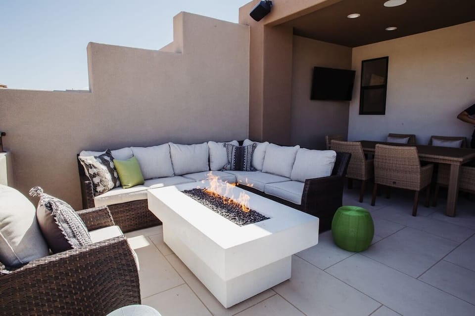 Balcony with Fireplace, Table, TV, and Hot Tub