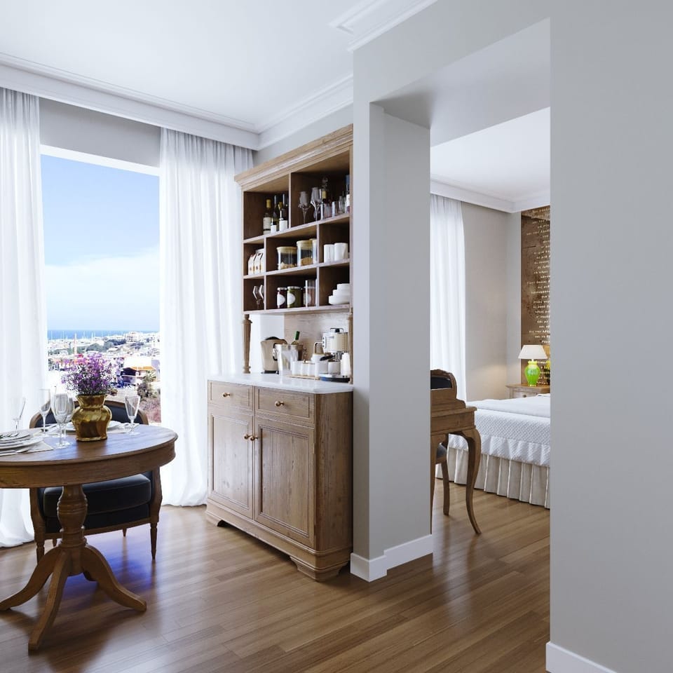 V Suite Sea View | Minibar, in-room safe, desk, blackout drapes