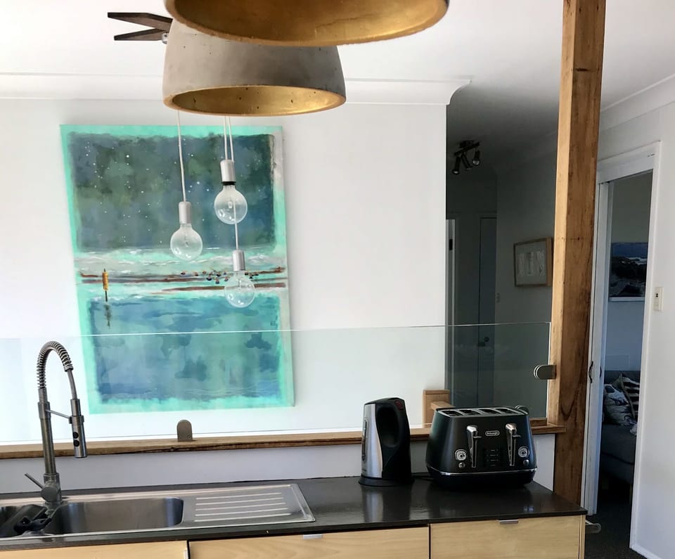 kitchen onto sun filled stairwell