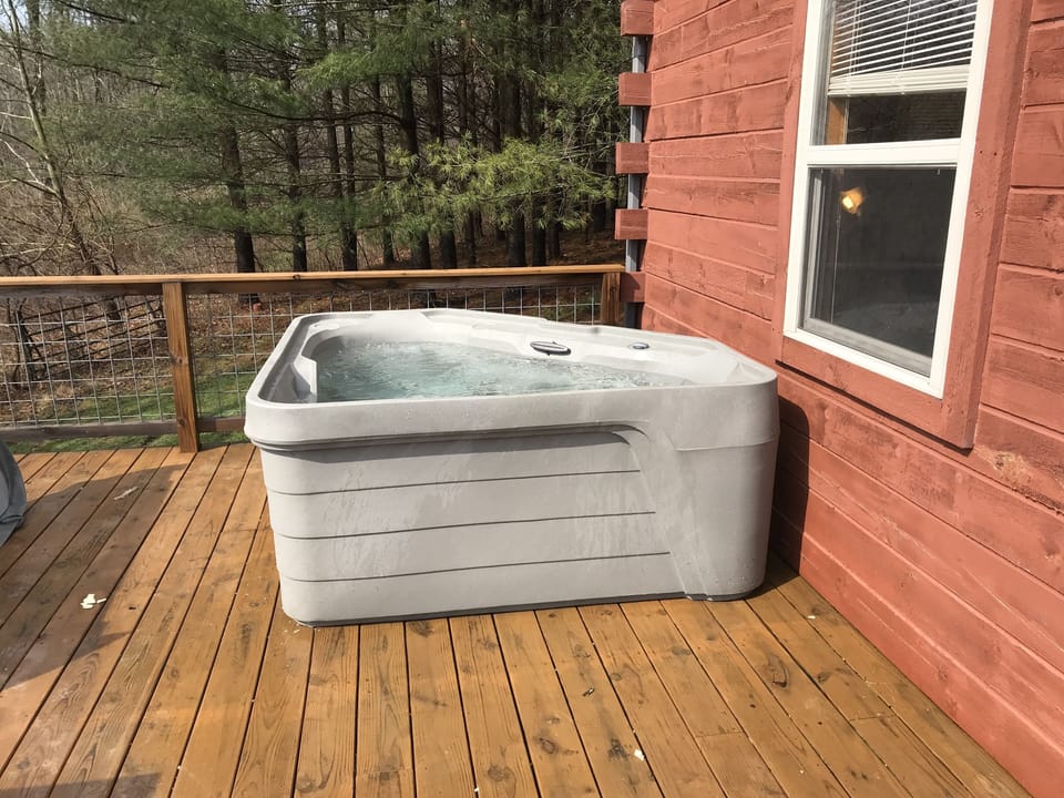 Hot Tub on back porch overlooking pond