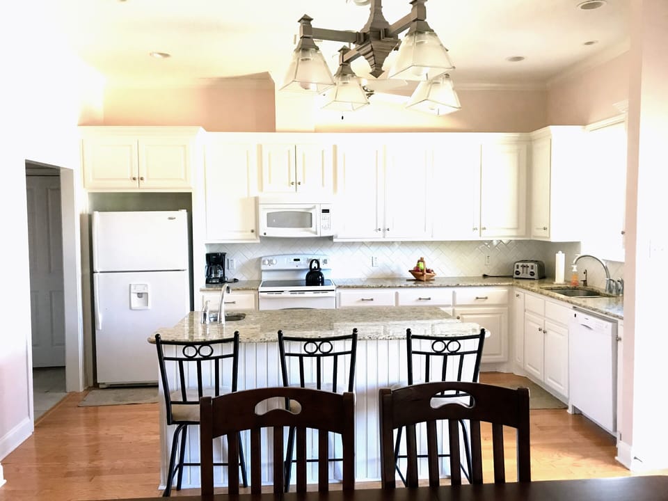Great room with kitchen, dining and living/tv area. 