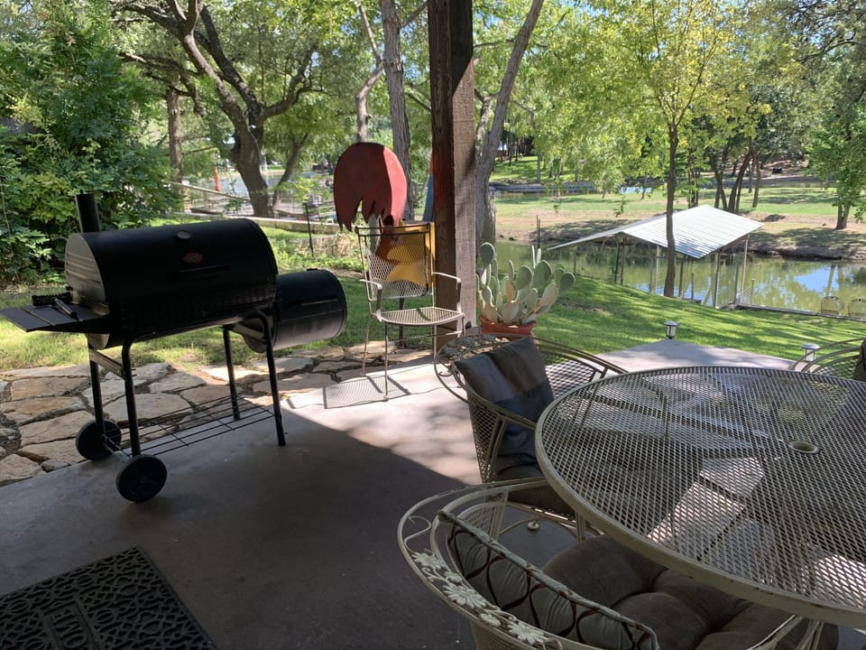 Charcoal grill on back covered patio. Don't forget your charcoal & lighter fluid