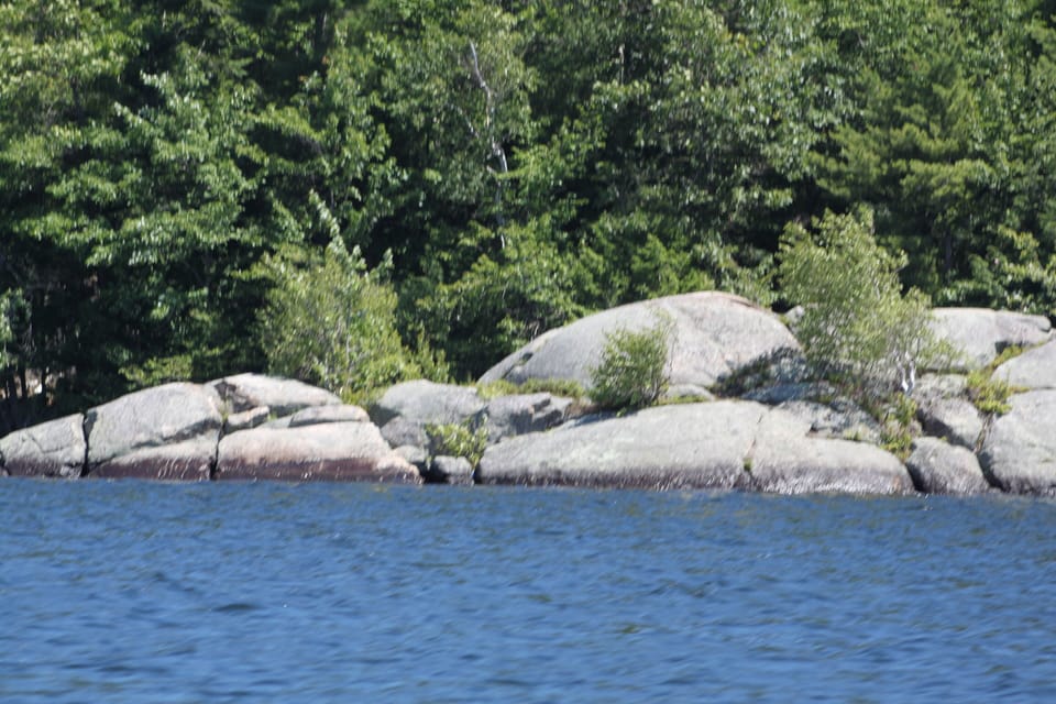 Rock Island a MUST. Near beach. Park boat and jump off. sandy beach near shore.