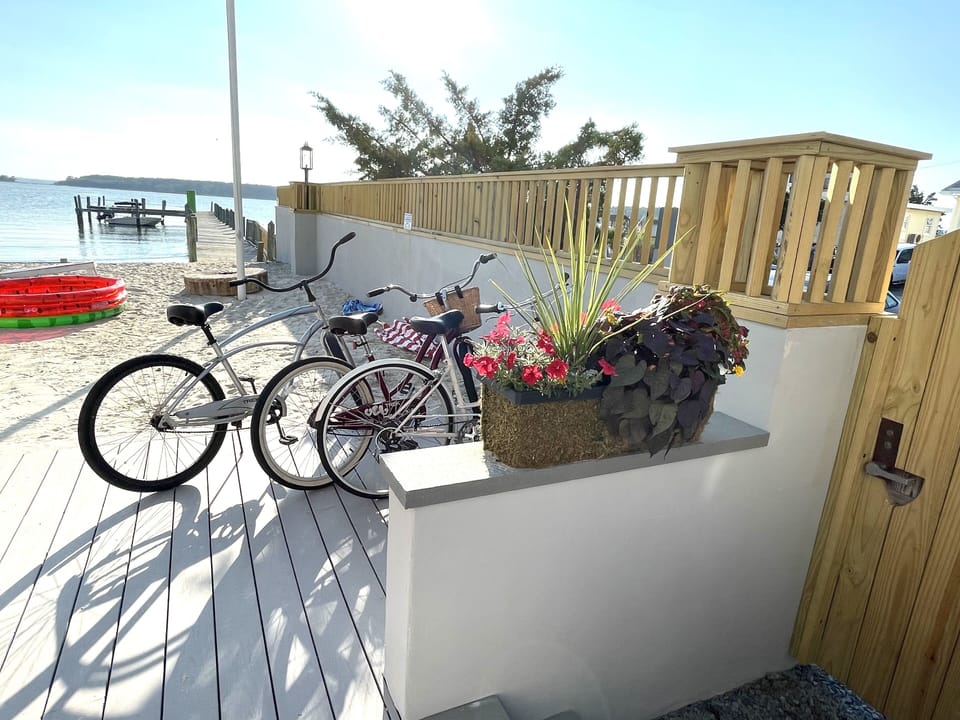 BIKES AND BEACH AT SNUG HARBOR; ONE OF TWO GATED ENTRANCES PICTURED HERE