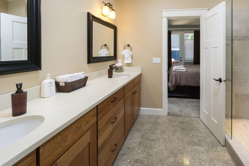 Main Level King Master Suite Bath with Double Sinks and Shower 