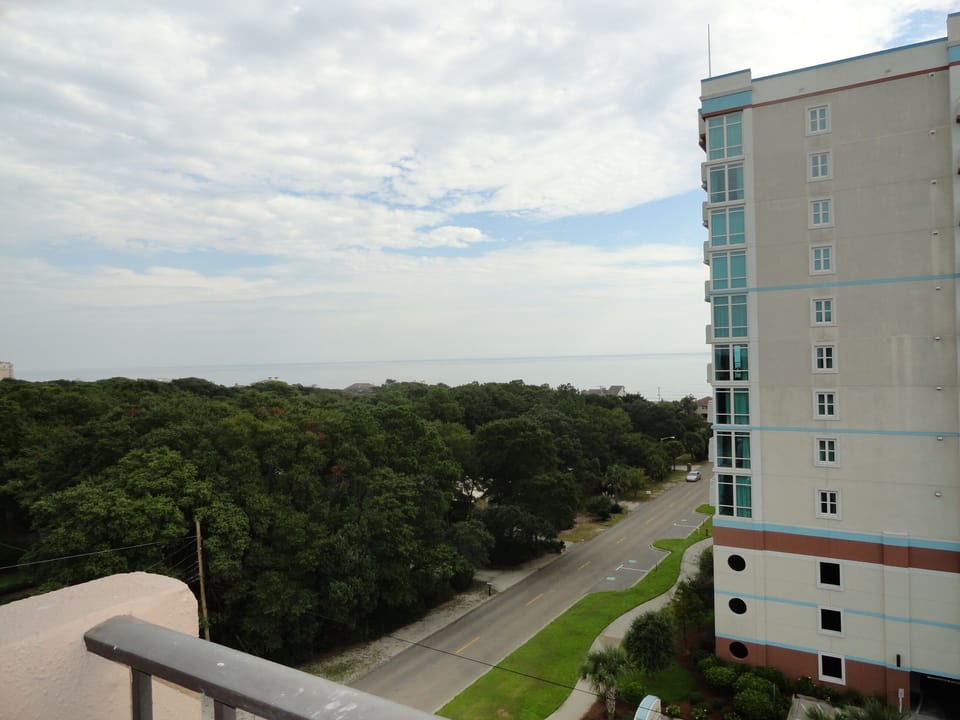 Ocean view from private balcony; short walk to beach