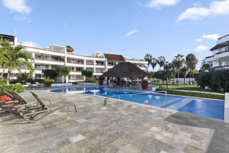 The back "kids" pool is also large and has loungers and a shaded area