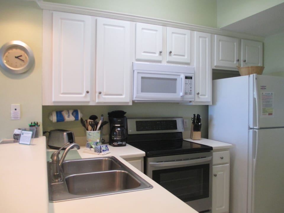 Glass top stove, Microwave, dishwasher & re frig with an ice maker.