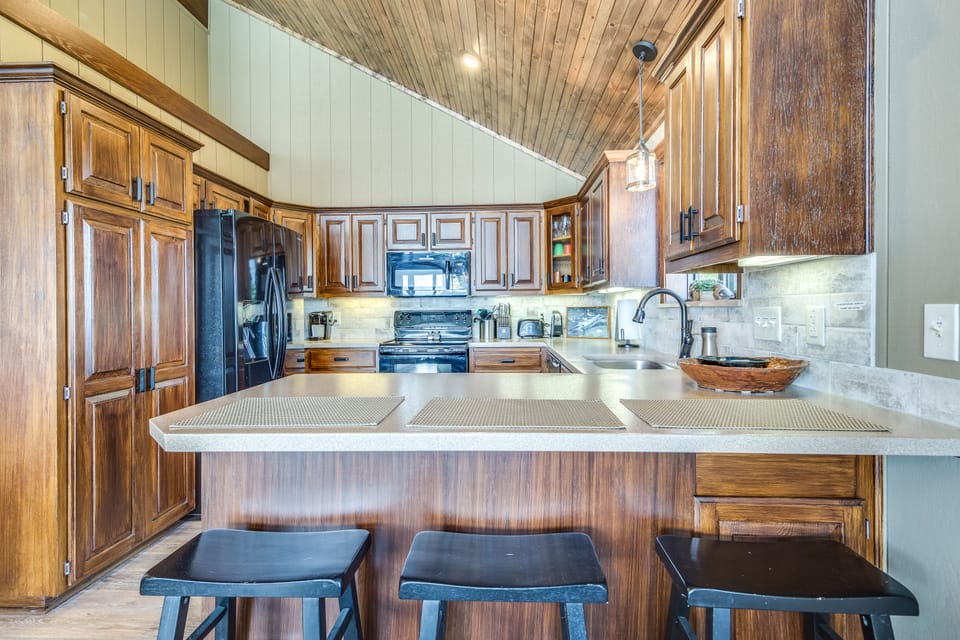Counter seating for 3 people - there is also a small table and chairs nearby.