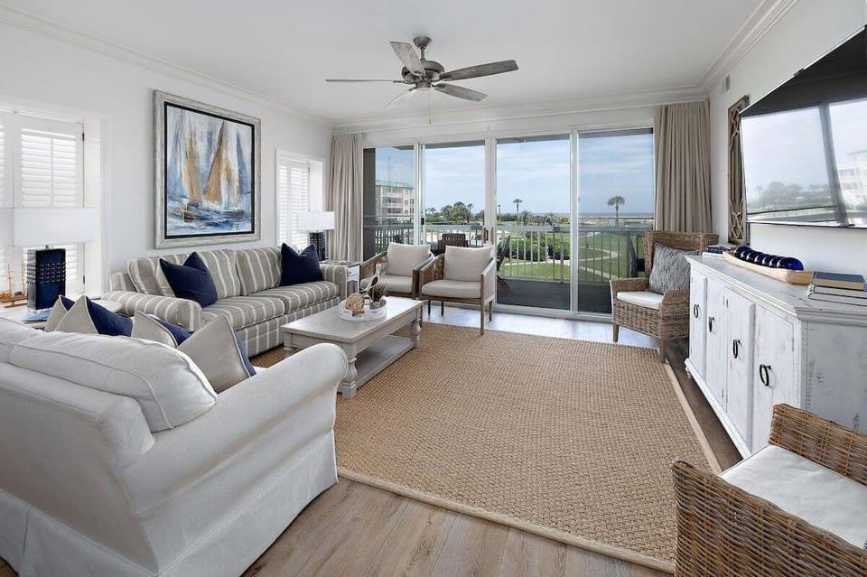 Saint Simons Grand #103 Living Space with Sofa Set, Patio Access, and Additional Chairs