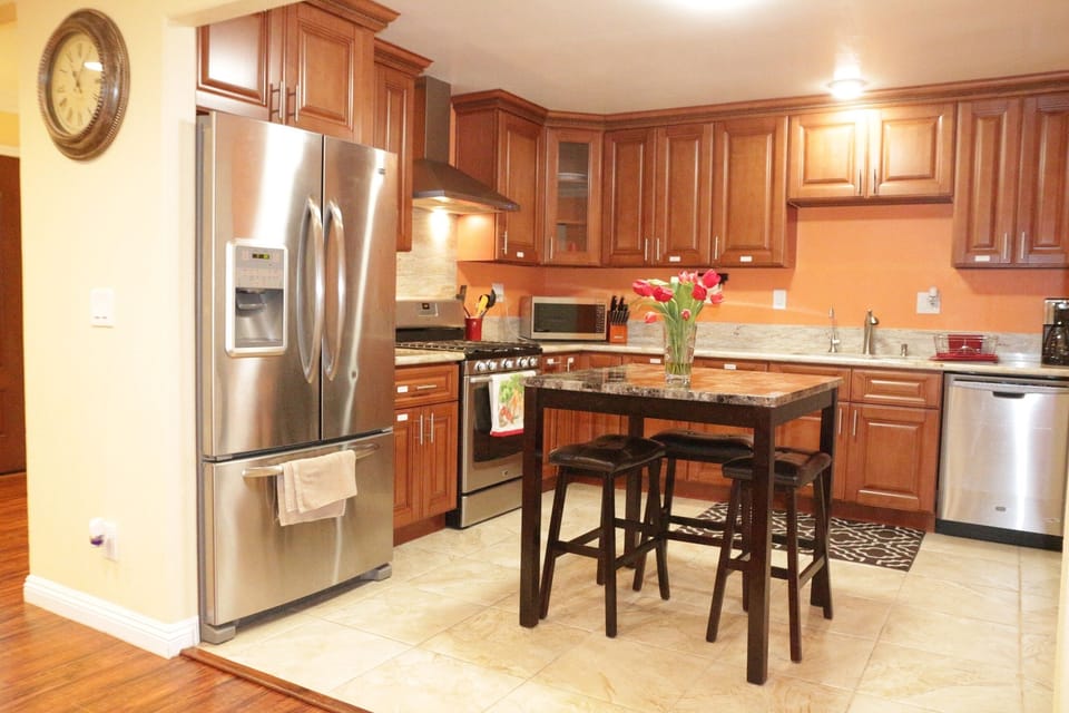 Full kitchen with refrigerator, range, microwave and dishwasher