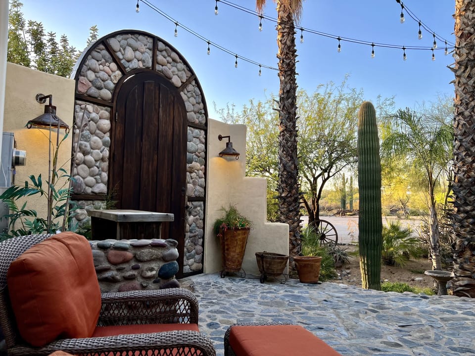 Outdoor entrance to main house patio w/ lush wash & spectacular lighting! 