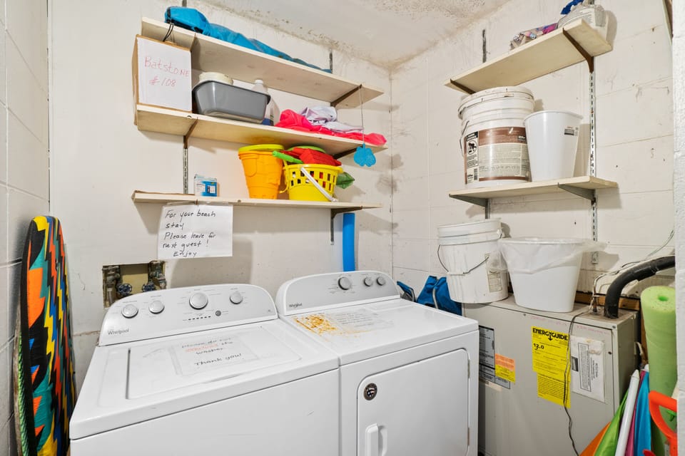 Private laundry room located across from the front door of the condo. 