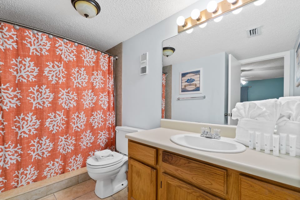 Master bathroom with a stand up shower and single vanity. 