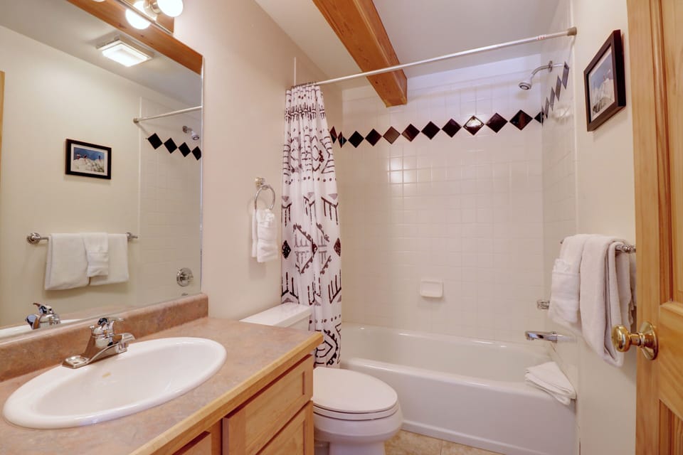 The upper level features a full bathroom off of the common area, in addition to the master bathroom.