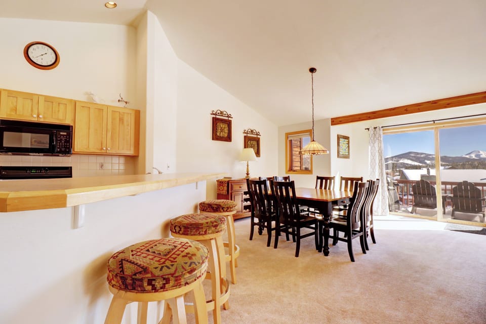 Open concept kitchen features barstool seating.