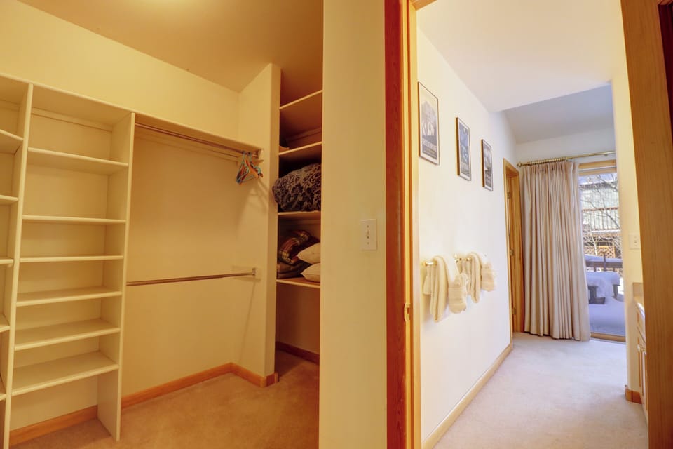 The master bedroom has an attached, walk in closet with ample storage space.