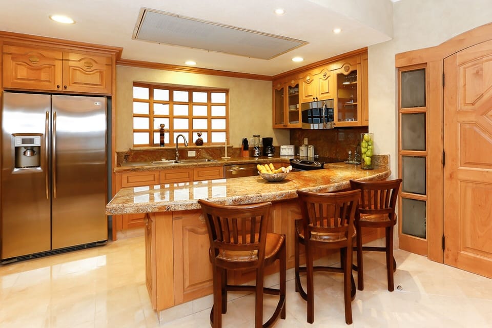 Full-sized kitchen with granite countertops and stainless steel appliances