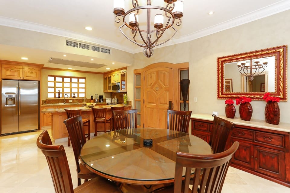 Entry into "A side". Full kitchen opens to 6-person dining room with 3-stool bar