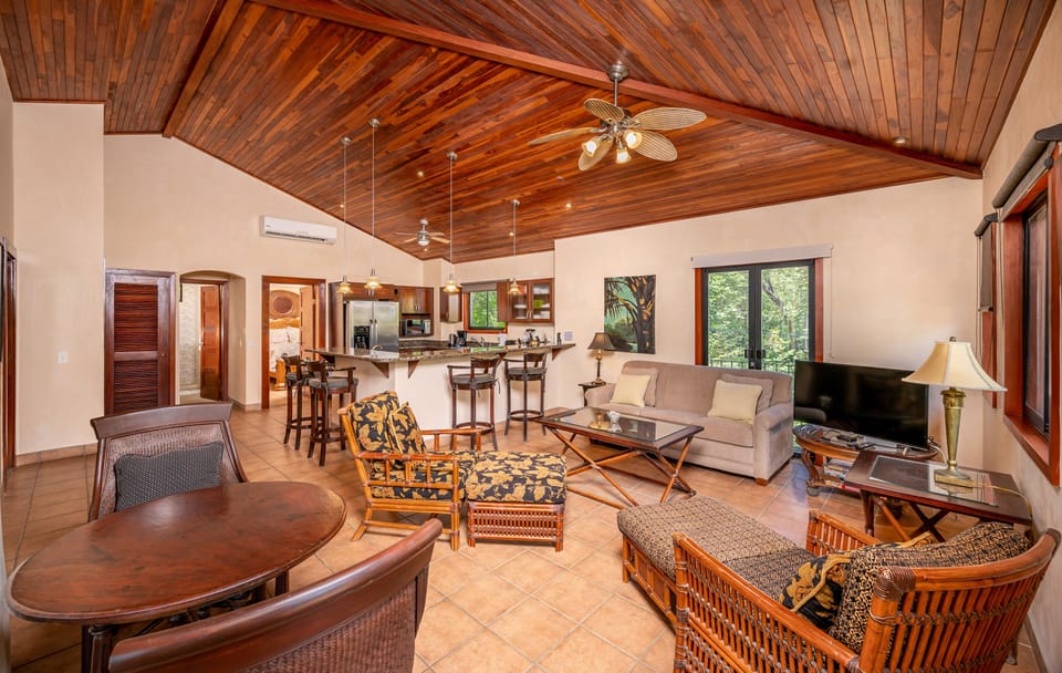 view from great room to kitchen - high teak ceilings