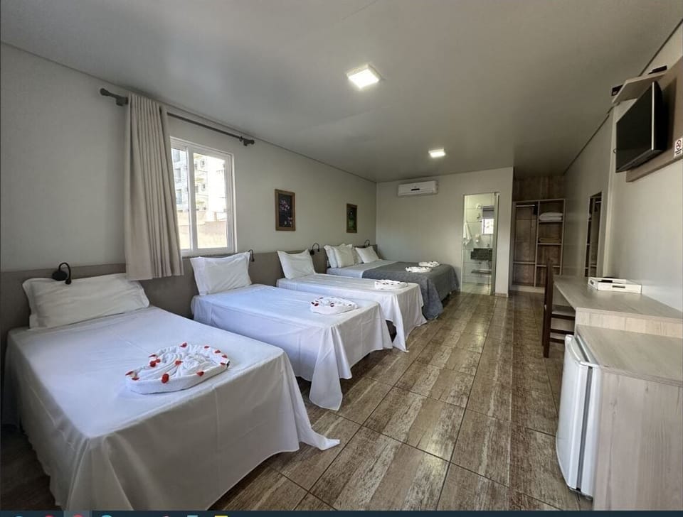 Standard Quadruple Room | Minibar, desk, blackout drapes, soundproofing