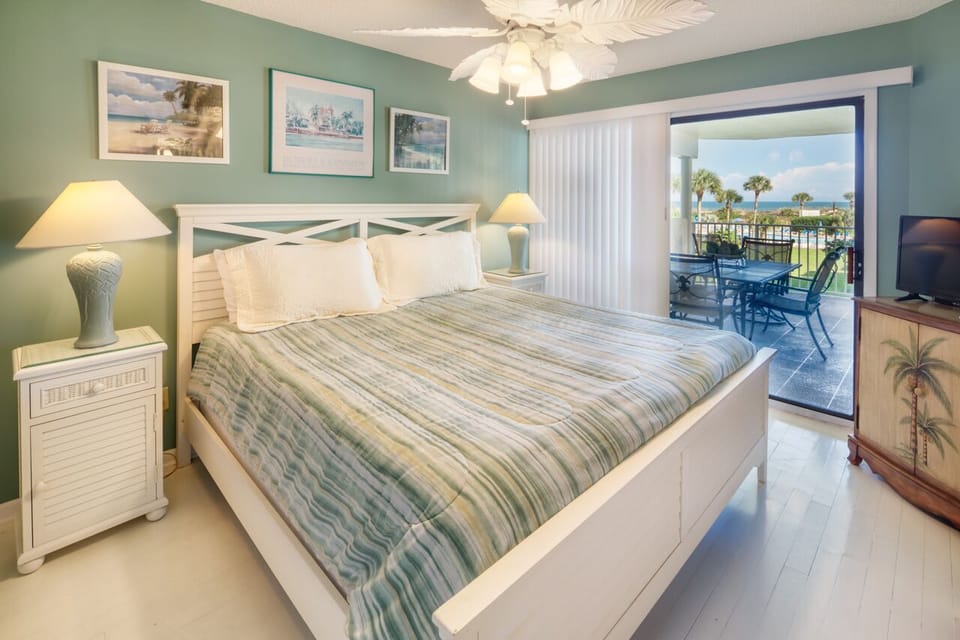 Primary Bedroom - Sleep in or wake up early and catch the sunrise from your private balcony from the primary bedroom.