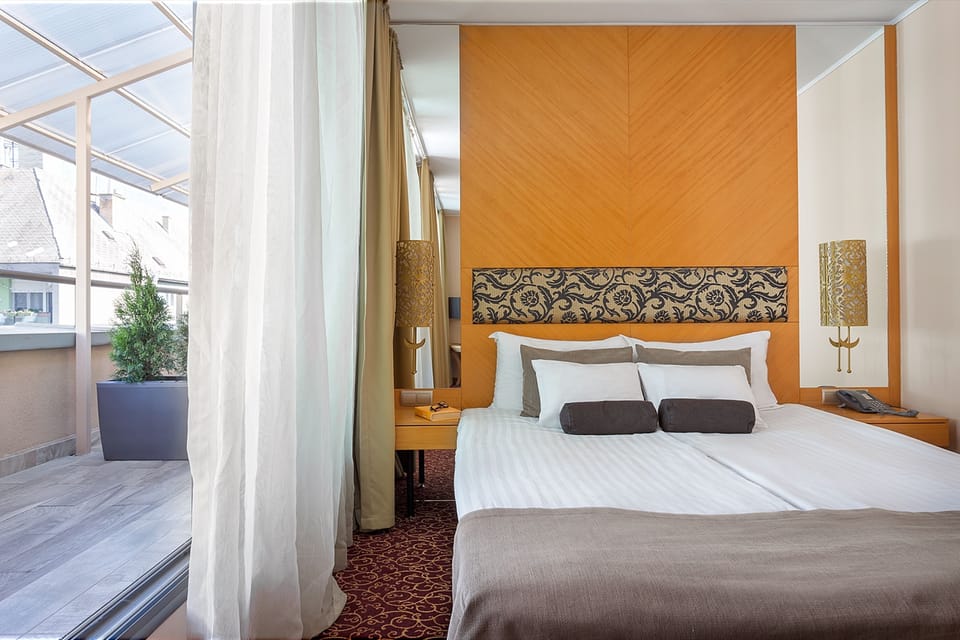 Junior Suite | Living area | 26-cm LCD TV with digital channels, TV