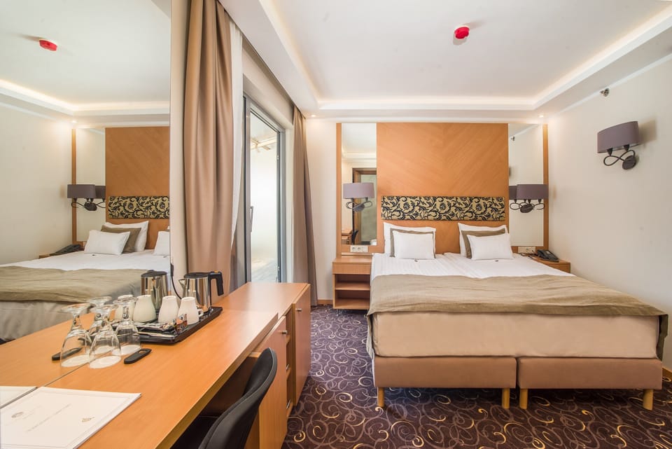 Deluxe Double Room | In-room safe, desk, laptop workspace, blackout drapes