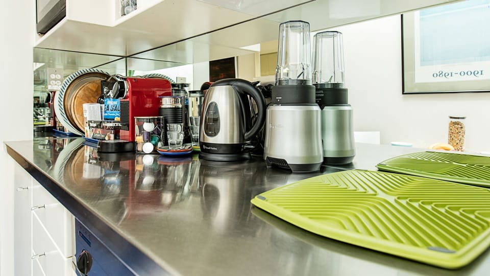 Modern and clean stainless steel benchtops with essential appliances