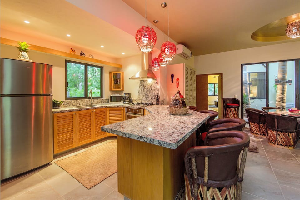 Atrium Level Fully Equipped Kitchen and Hospitality Peninsula Sitting Area...