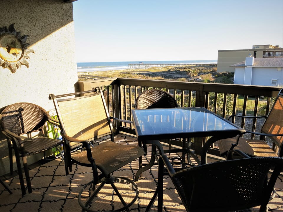 Bistro seating and table for 4 on balcony.