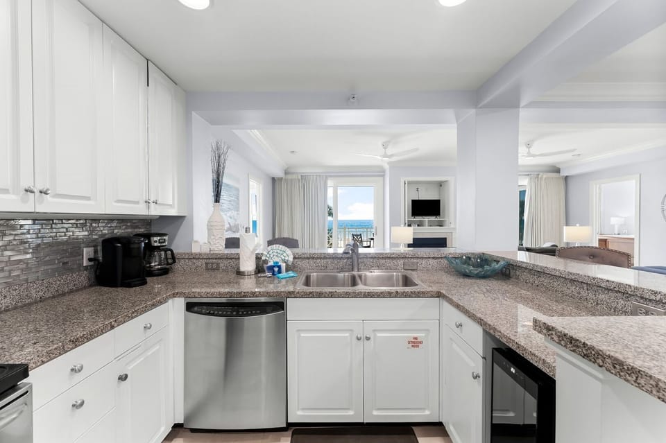 Kitchen has stainless steel appliances to whip up delicious meals and a wine cooler to keep your drinks cold