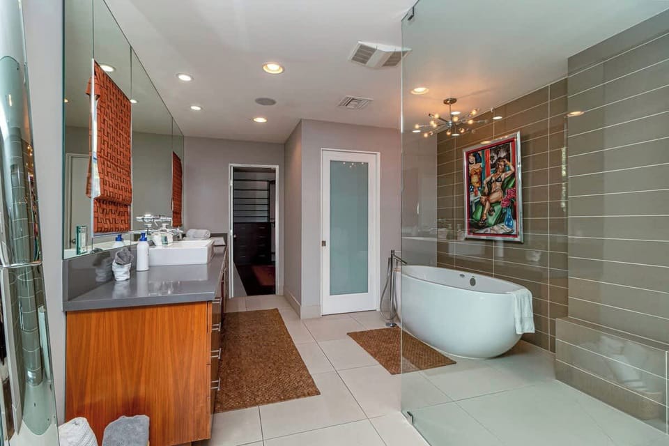 The private en-suite bathroom is accessible through the master bedroom