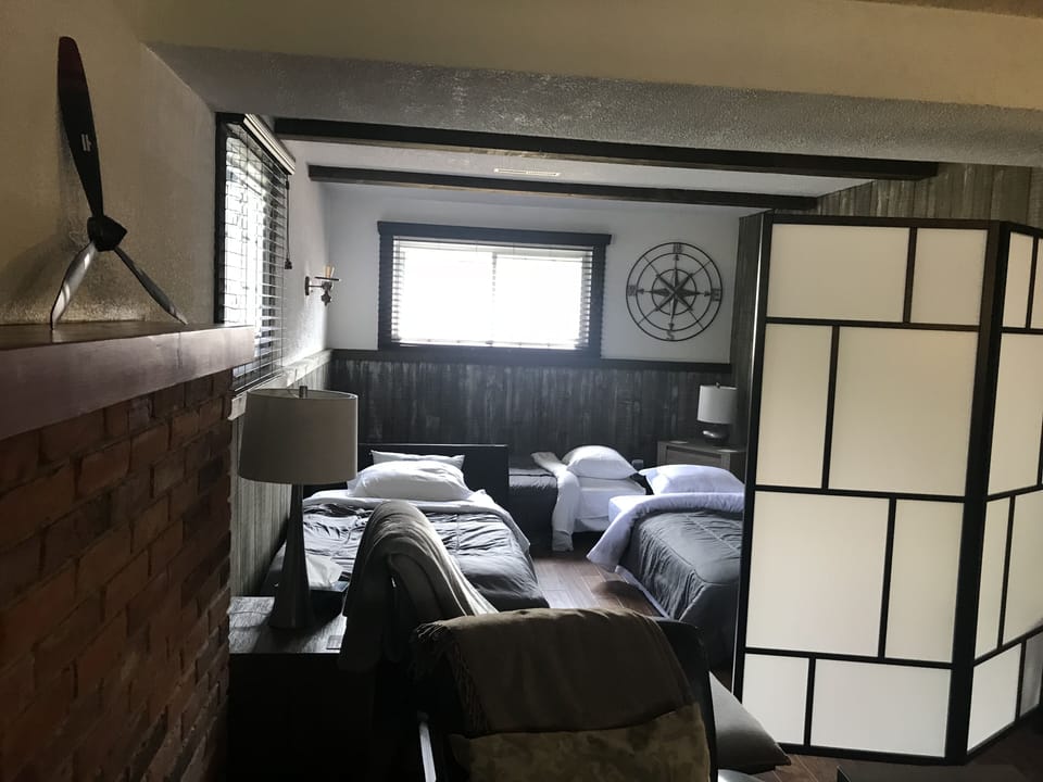 Greatroom Alcove with convertible beds in use and room divider