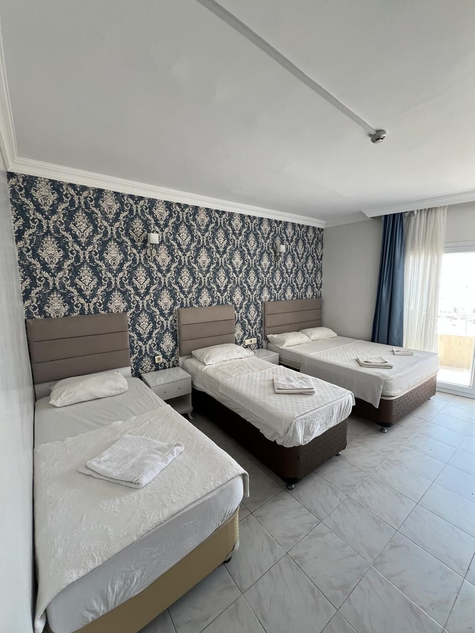 Quadruple Room | Premium bedding, desk, blackout drapes, soundproofing
