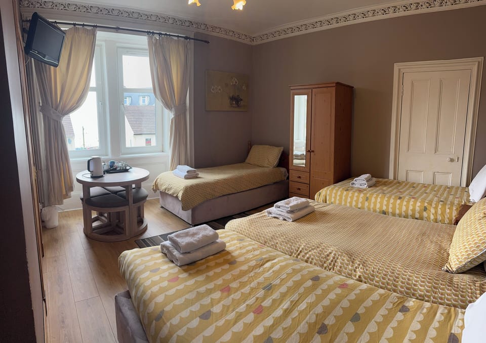 Family Room, Multiple Beds, Sea View | Individually decorated, individually furnished, iron/ironing board