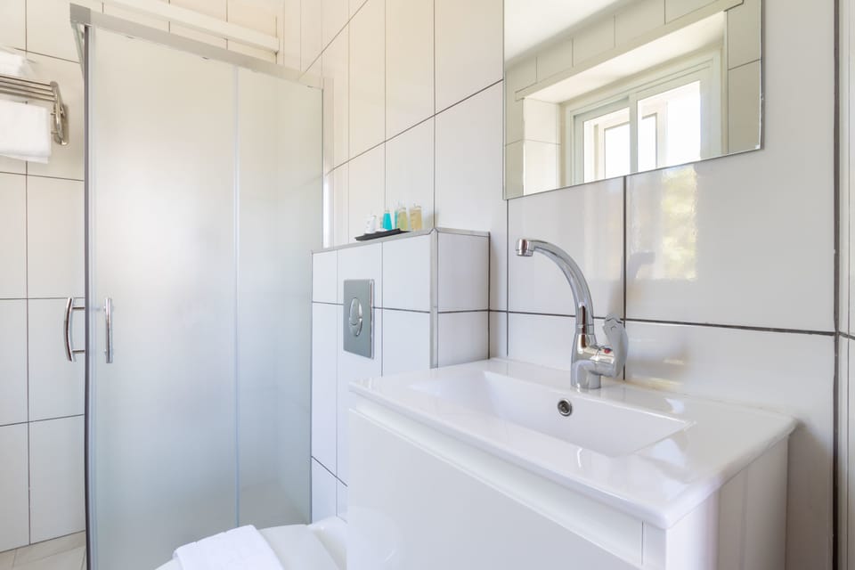 Shower, free toiletries, hair dryer, slippers